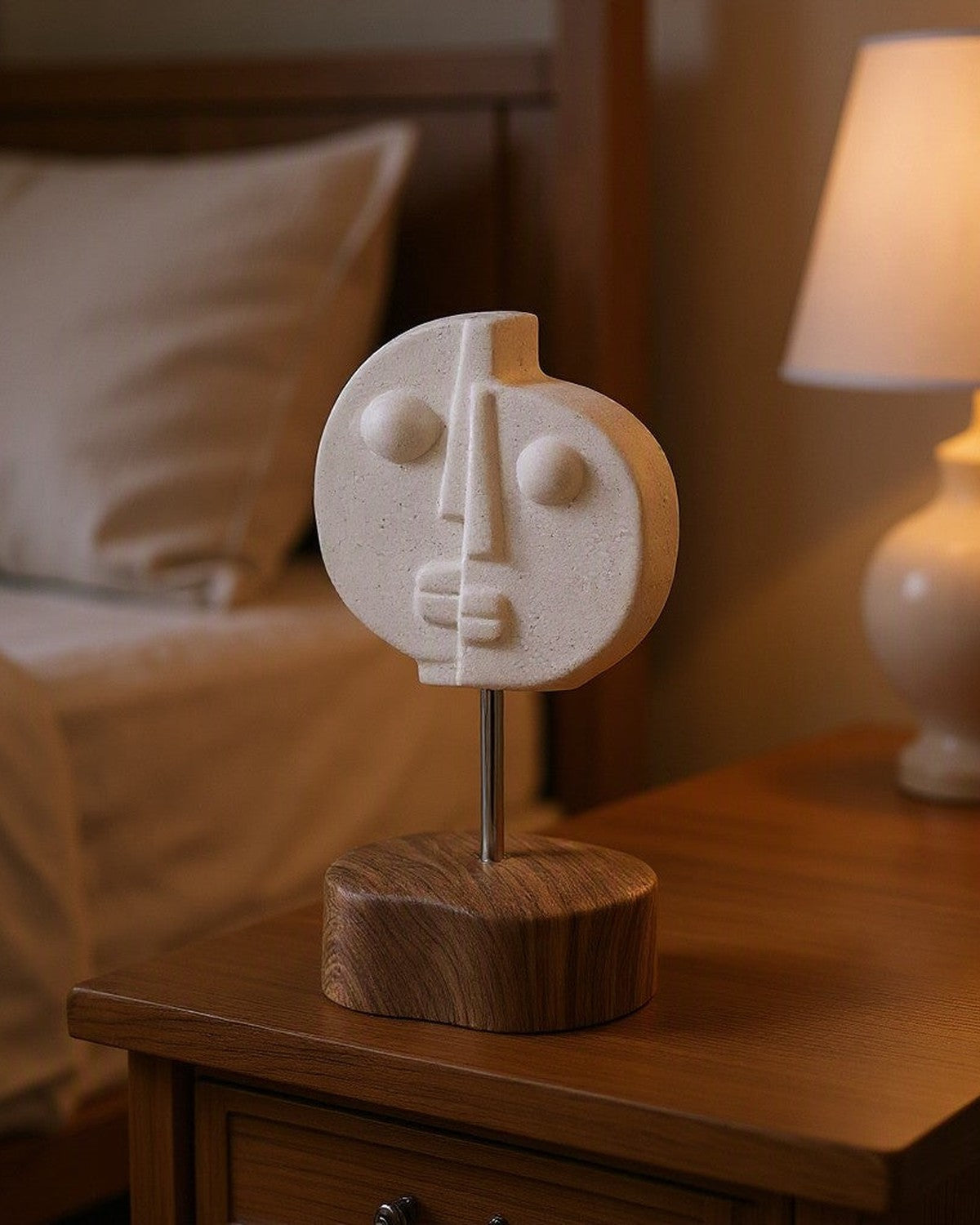 Two-Faced Ceramic Ornament styled in a bedroom
