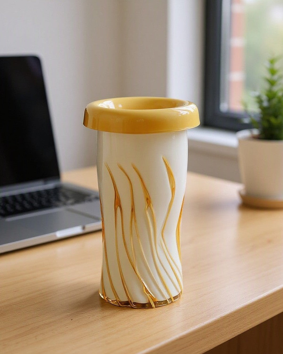 Curled Mouth Yellow-Striped Vase on a desk