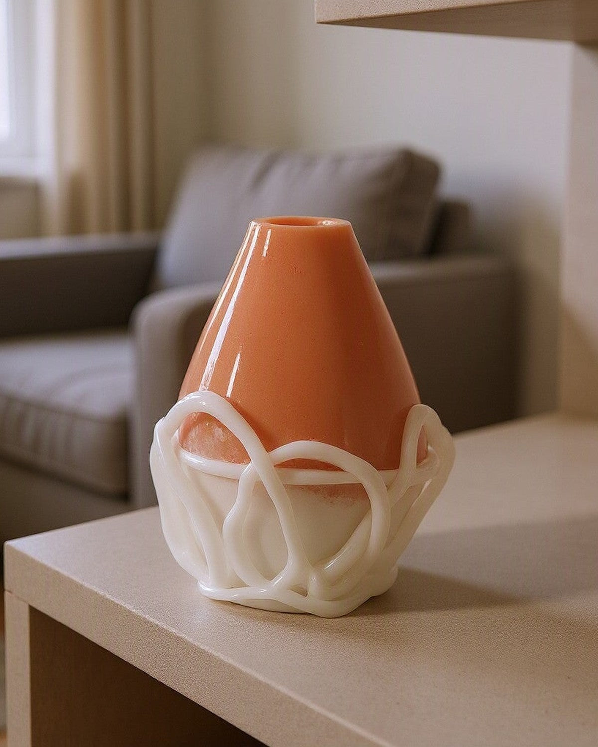 White & Orange Veined Glass Vase styled in a living room