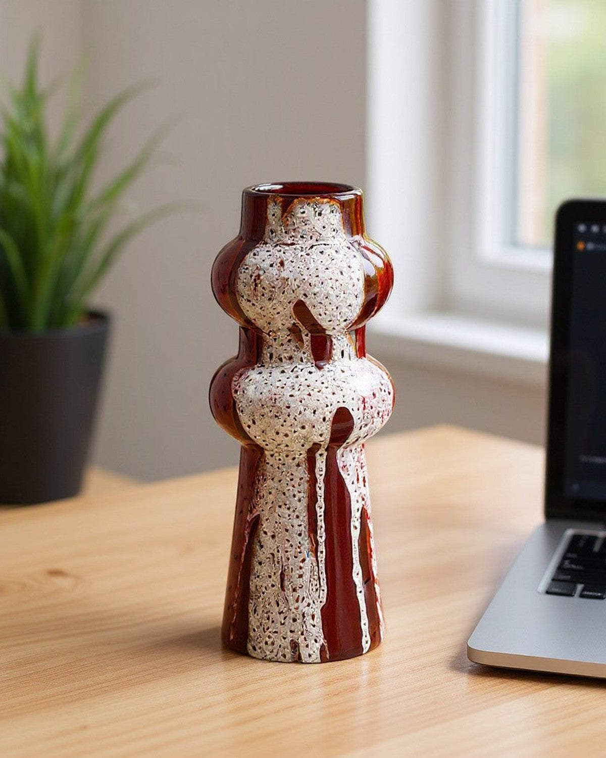 Colorful Splashed Glaze Ceramic Vase on a desk