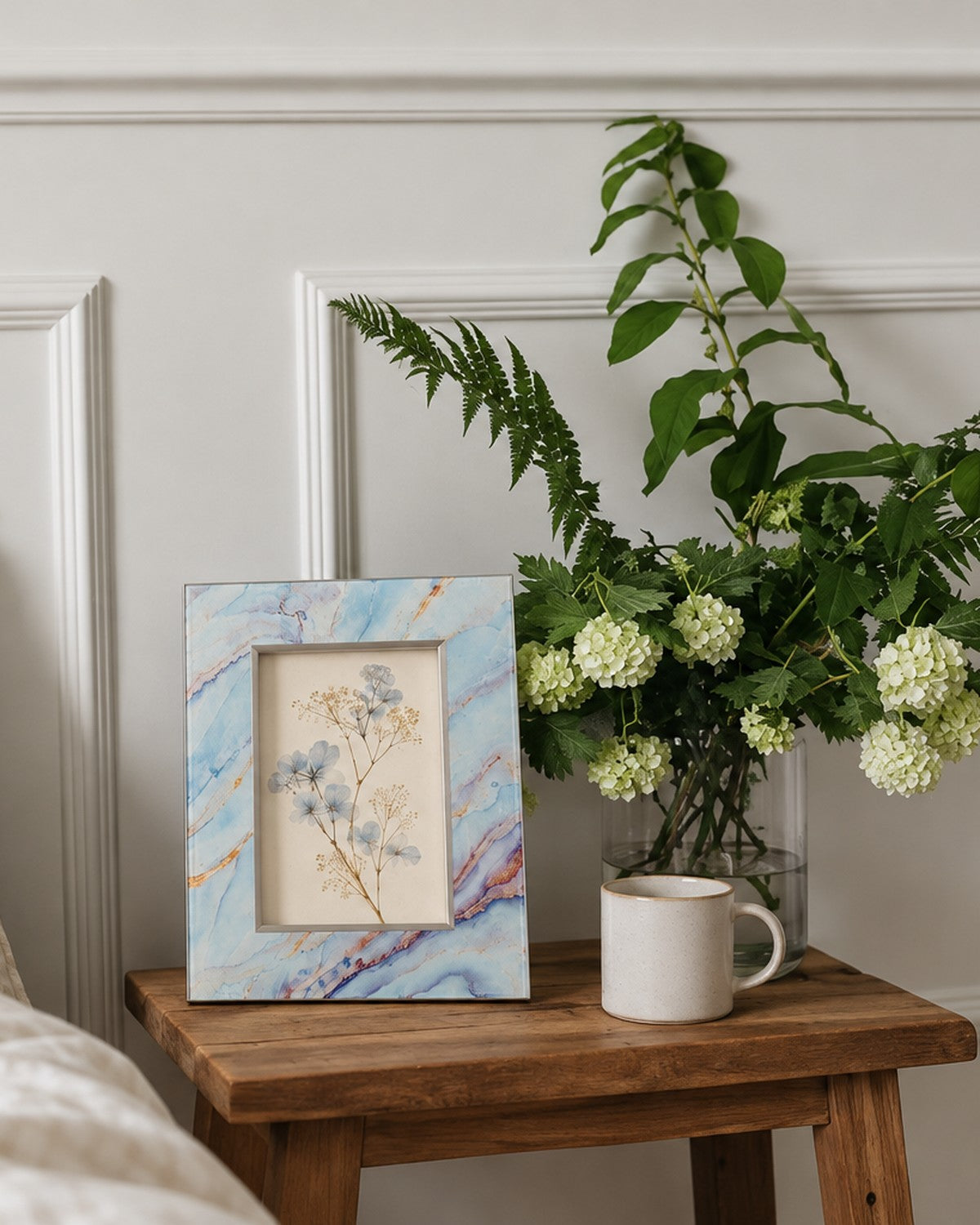 with a vase of greenery
