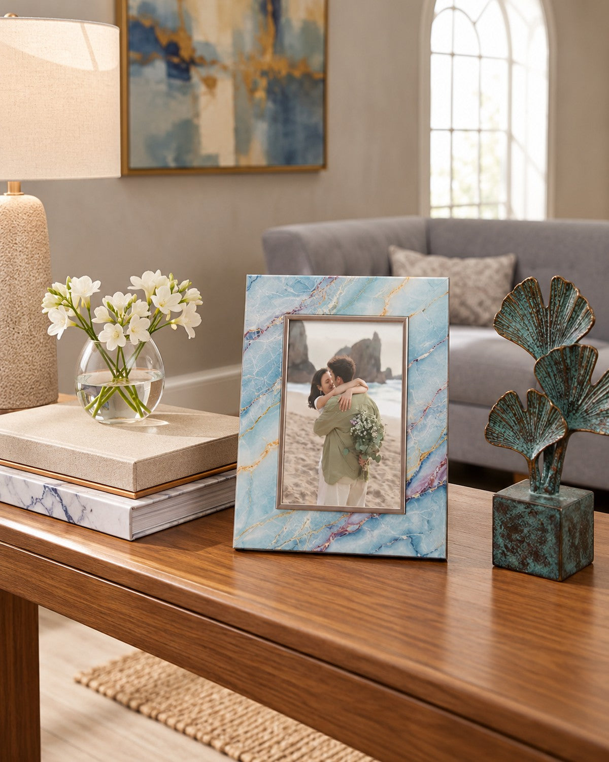 with books, flowers, and a bronze sculpture